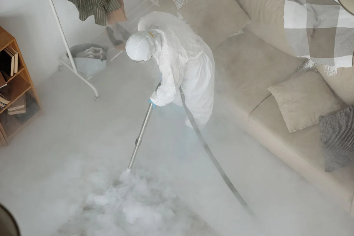 Biohazard cleanup technician in protective equipment, Marshfield, MA